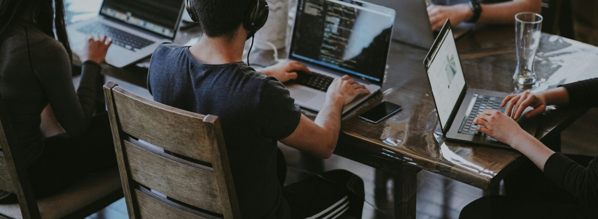 group of people using laptop computer